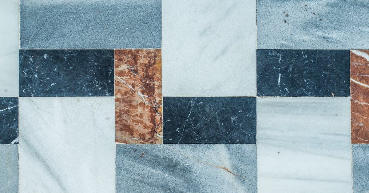 A close up of a marble floor with a checkered pattern.