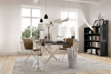 A room with a table and chairs in it