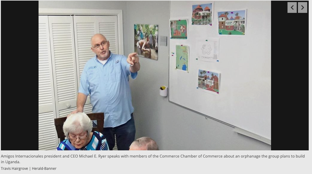 A man is giving a presentation to a group of elderly people.