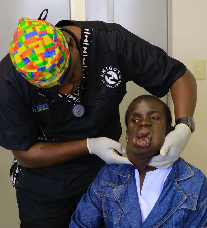Dr. Paul examining Bridgette for treatment
