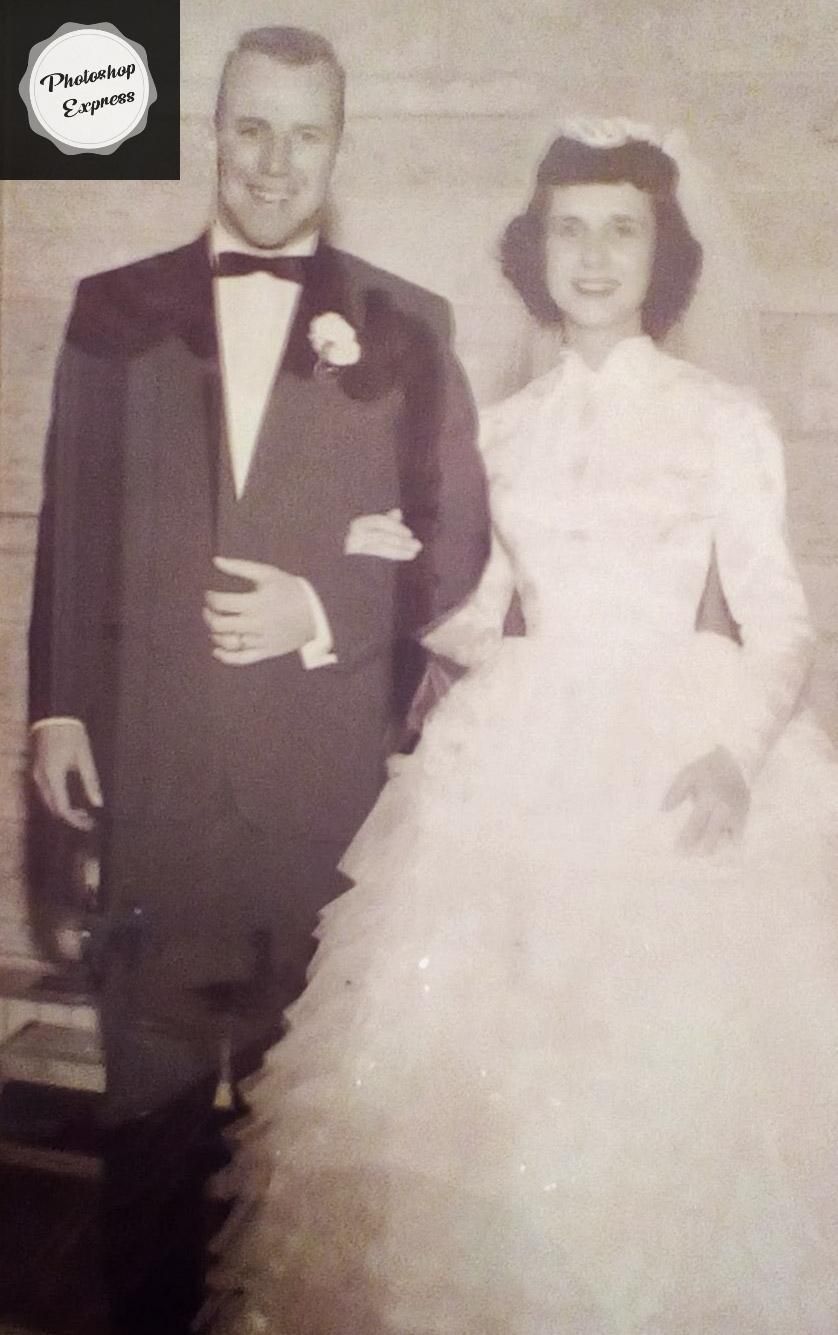 A black and white photo of a bride and groom on their wedding day
