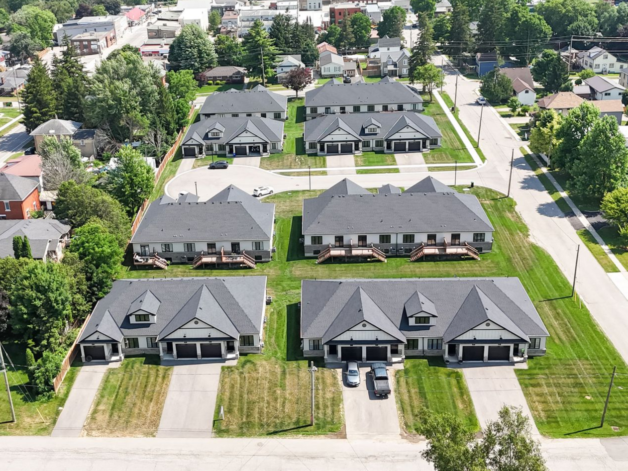 Aerial view of multiple, gray-roofed apartment buildings for engineering project portfolio Ontario
