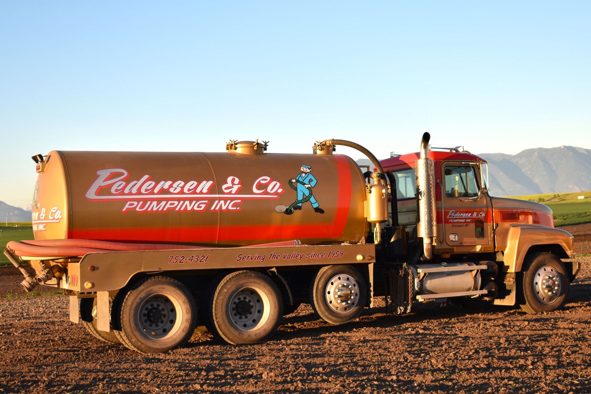 Company vehicle side view — Kalispell, MT — Pedersen & Co Pumping, Inc.