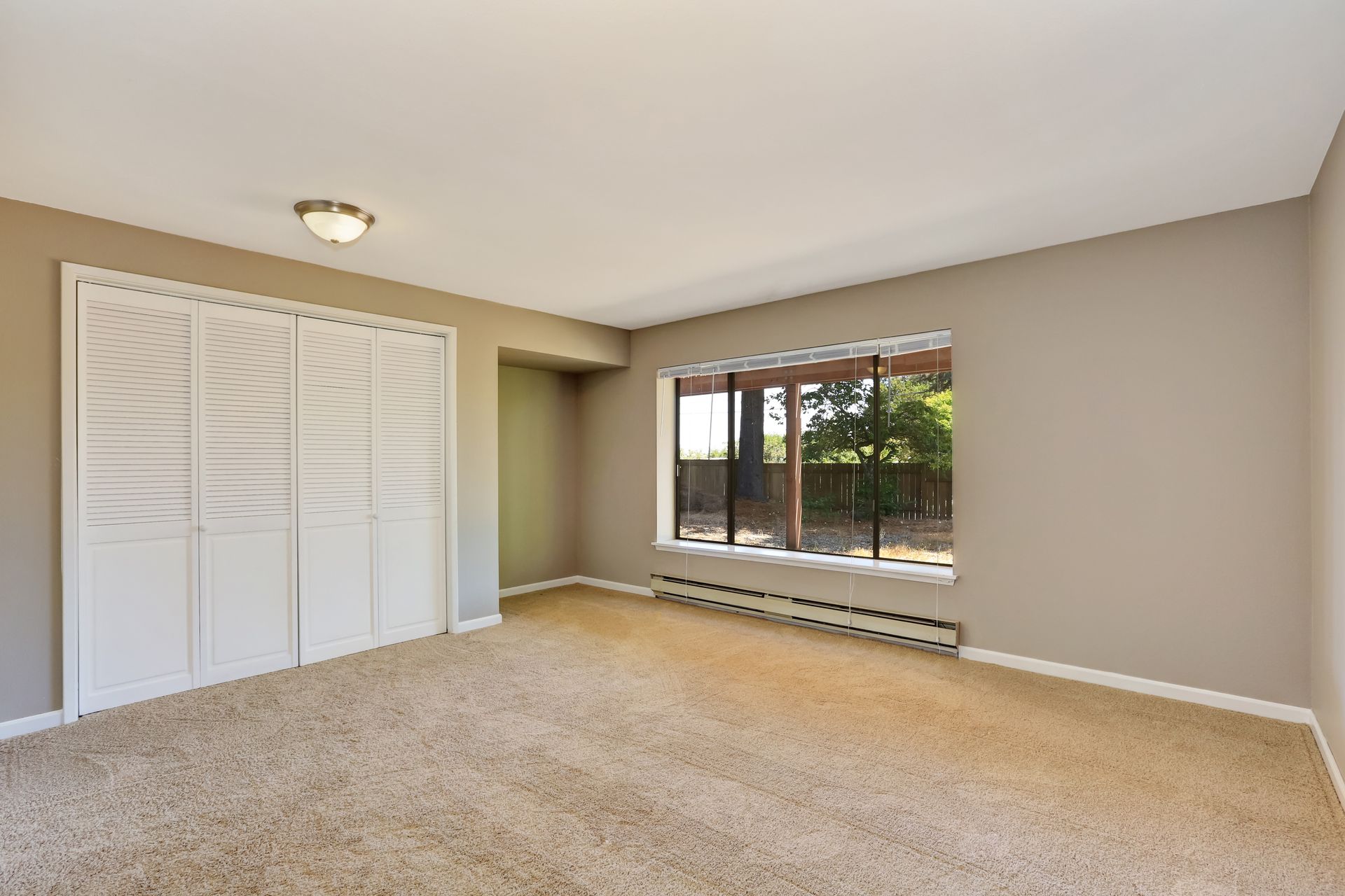 Empty beige room with closet and carpet floor. Northwest, USA