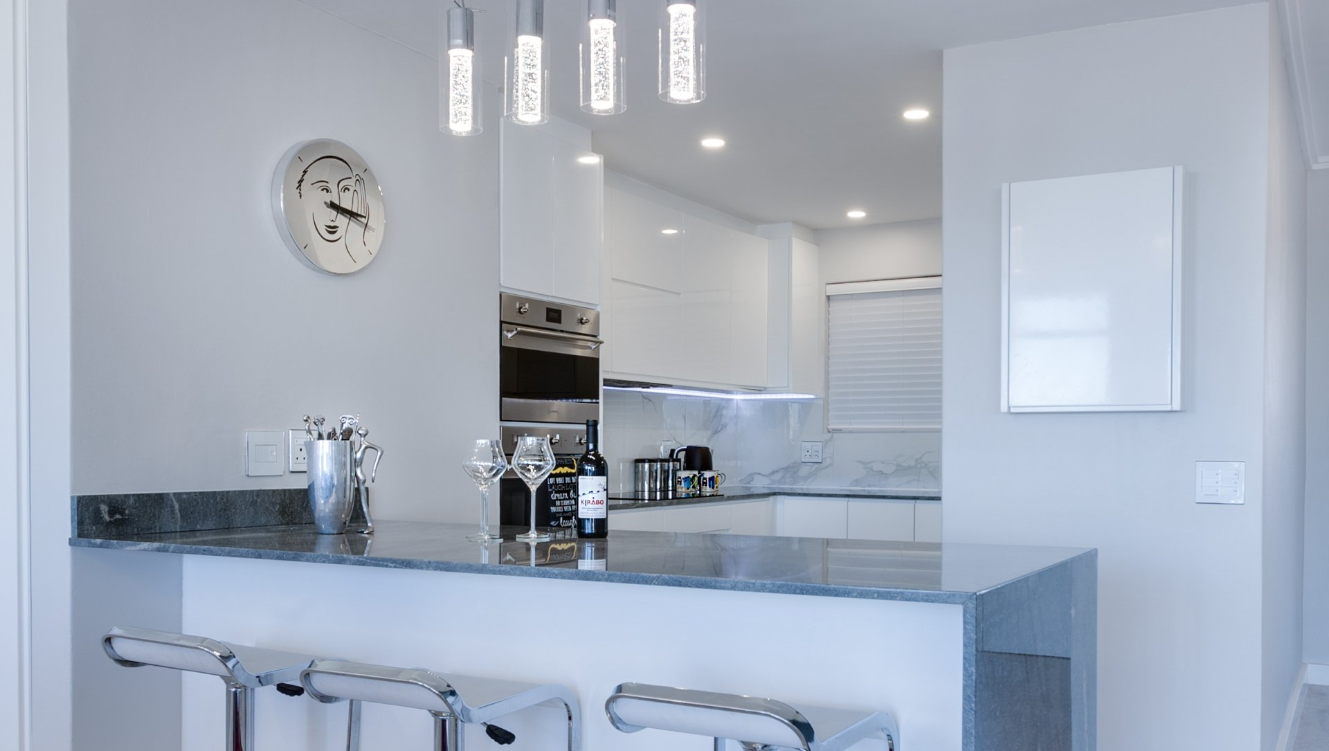 kitchen with wine glasses on counter
