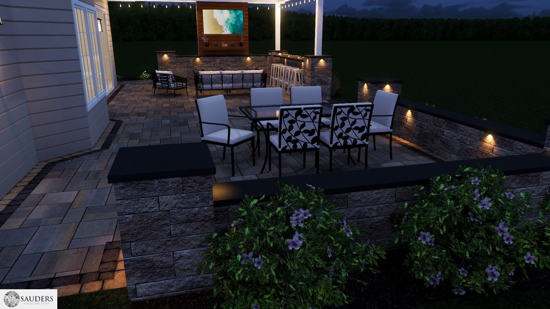 Outdoor patio at dusk with dining table, built-in grill, and low retaining wall with accent lighting.