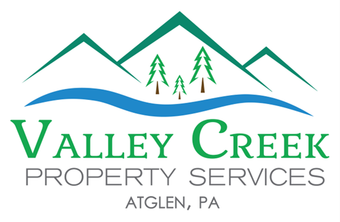Logo for Valley Creek Property Services, featuring green mountains, a blue creek, and text.