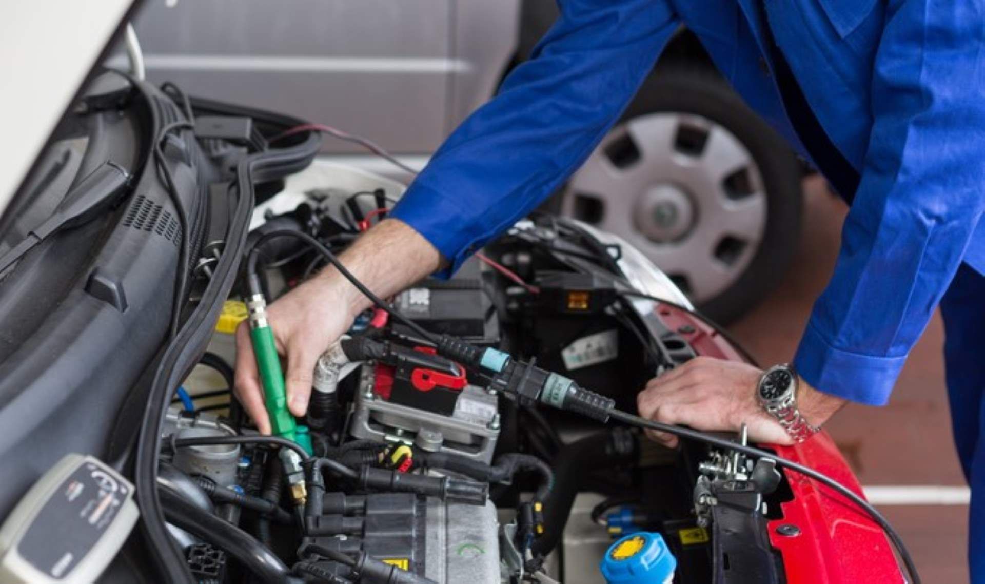 A Mechanic is Working on the Engine of a Car in a Garage — Fraser Mobile Auto Tech in Tolga, QLD