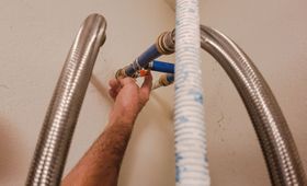 hand fixing water heater