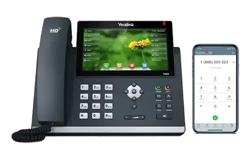 Yealink IP phone with color screen and a smartphone side-by-side on a white surface.