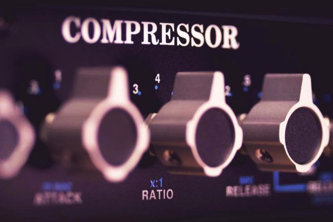 A close up of a compressor with several knobs
