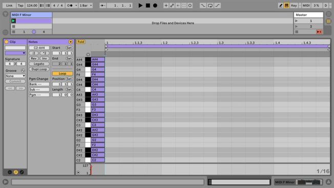 A computer screen shows a few lines of music