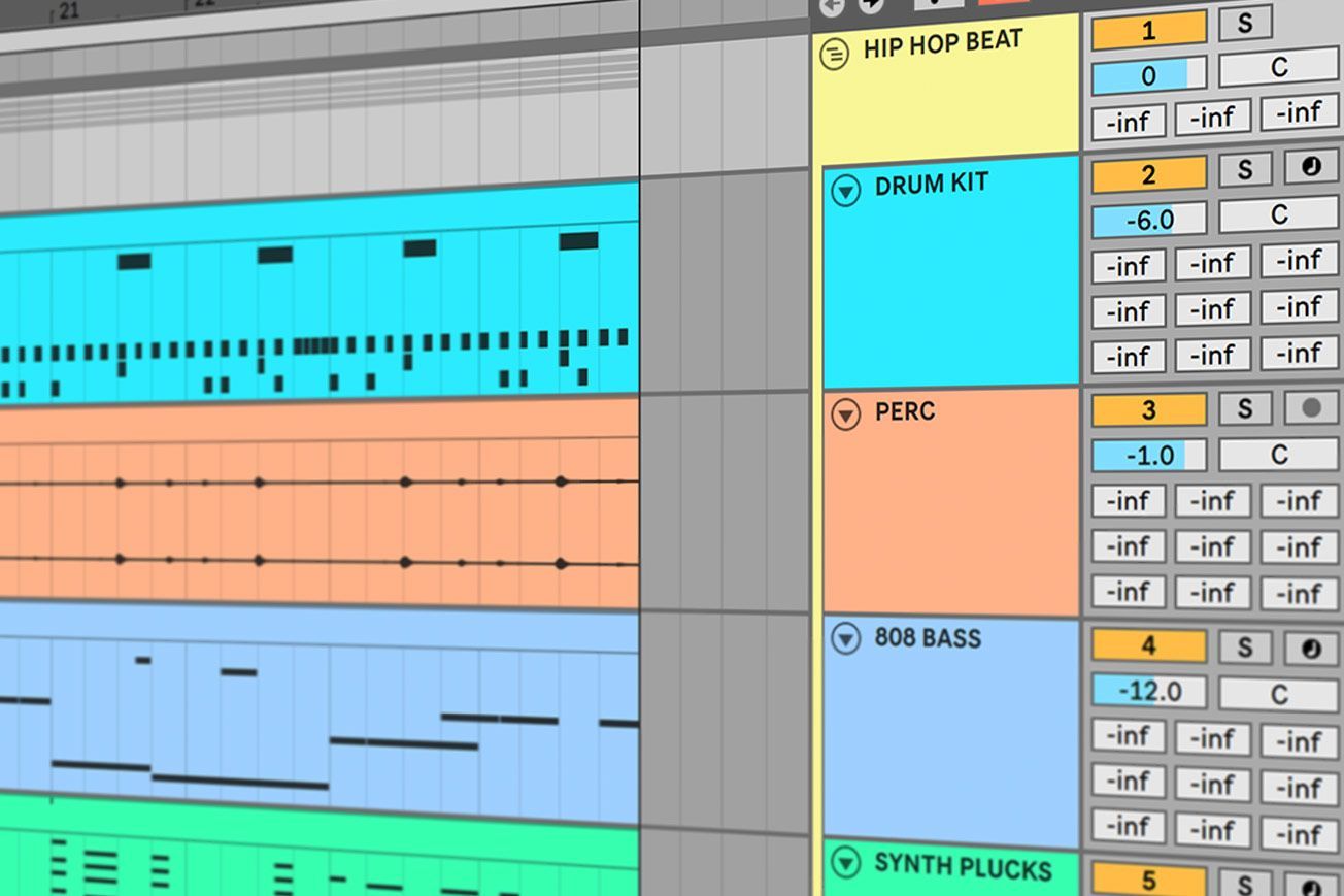 A computer screen shows a drum kit and a synth plug in