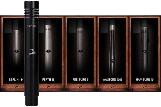 A microphone is sitting in front of a row of boxes.