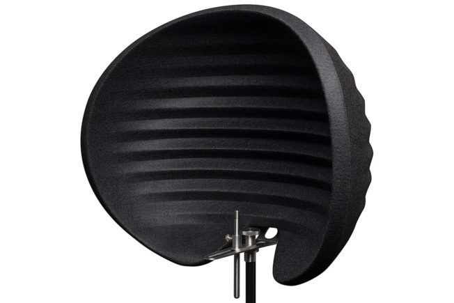 A black object is sitting on a stand on a white background