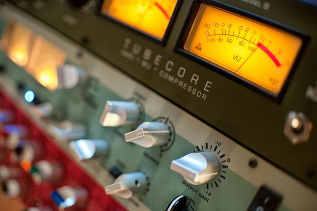 A close up of a tubecore compressor with a yellow gauge