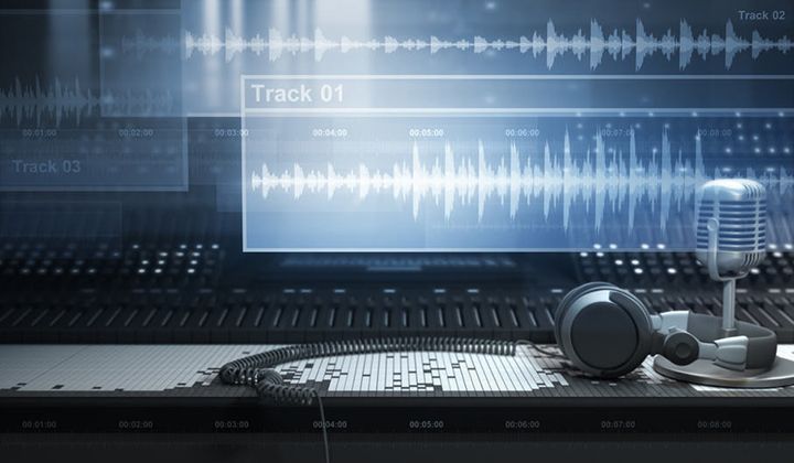 A pair of headphones sitting on top of a computer keyboard.
