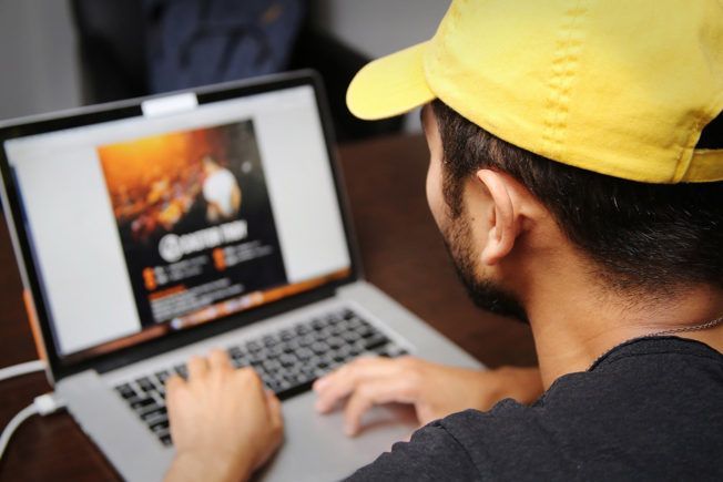 A musician’s laptop displaying an EPK (electronic press kit), music links, and professional photos.