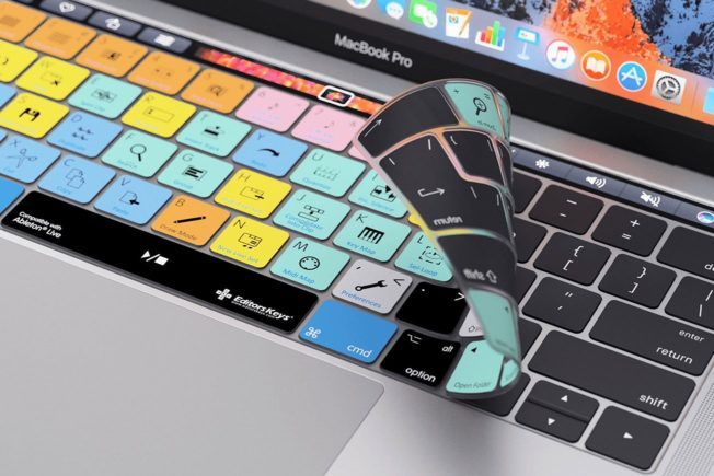 A macbook pro laptop with a keyboard cover on it