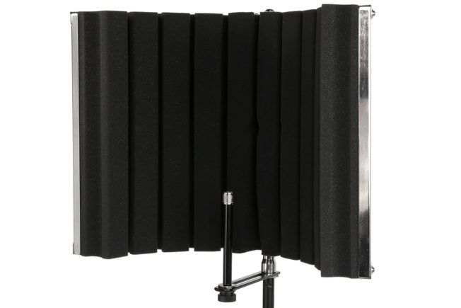 A black microphone shield is sitting on a stand on a white background.