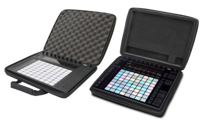A briefcase with a keyboard inside of it