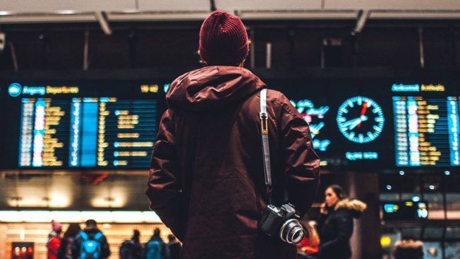 Man Looking at Flight Schedules