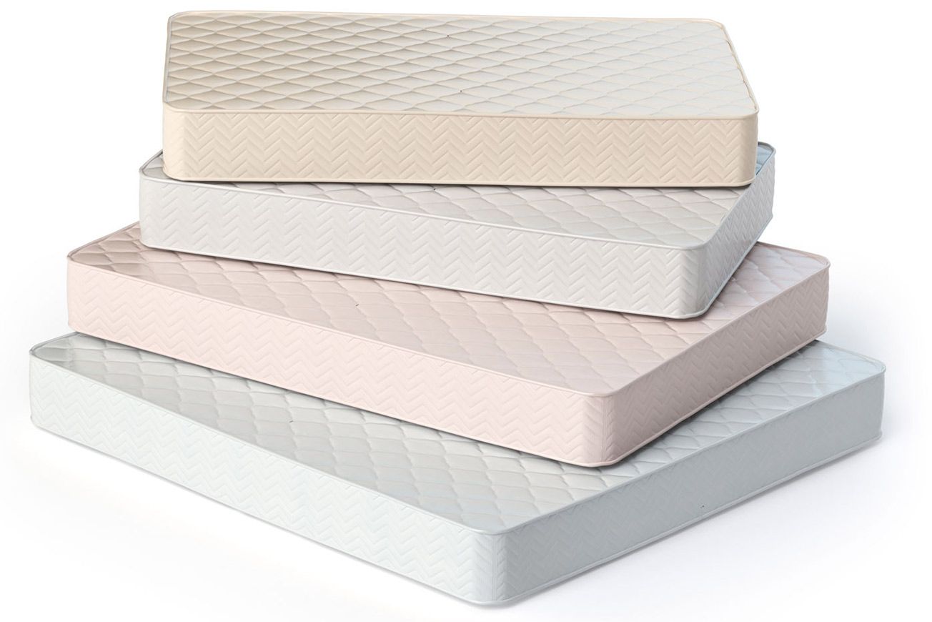 Four mattresses are stacked on top of each other on a white background.