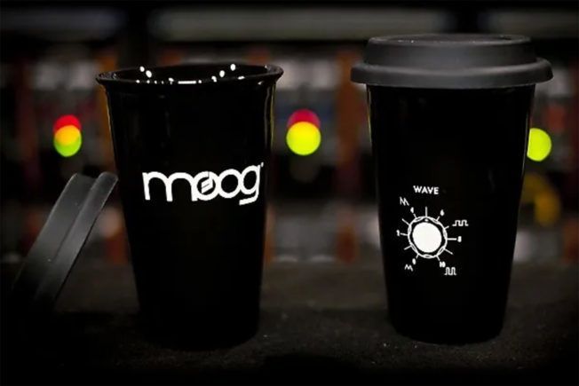 Two black coffee cups with the word meog on them