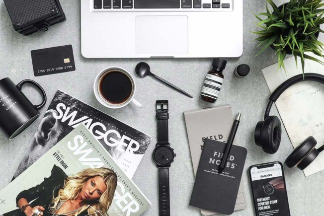 Music Publicist Desk with Macbook Pro DSLR Camera and Mug