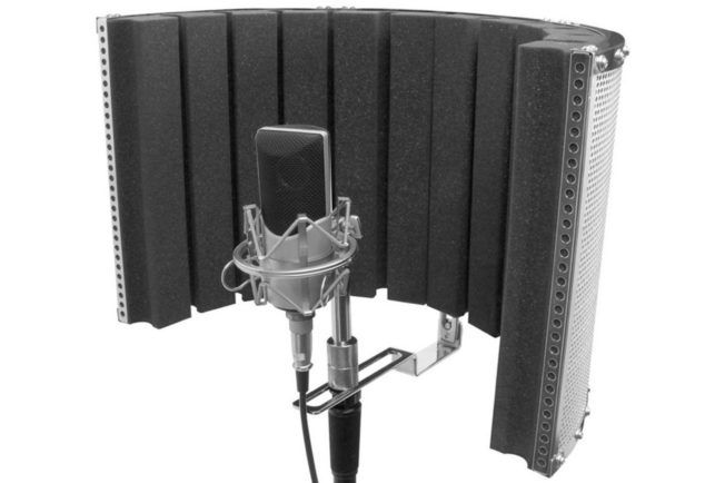 A microphone is sitting in front of a foam shield