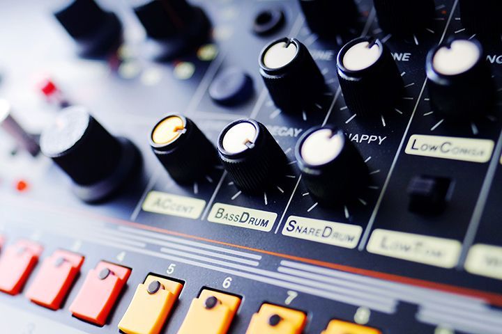 A close up of a mixer with knobs and buttons that says band drum on it