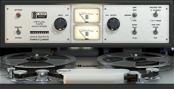 A close up of a tape recorder with two meters on it.
