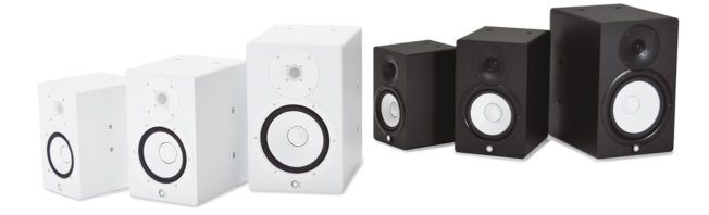 A group of speakers are lined up in a row on a white background.