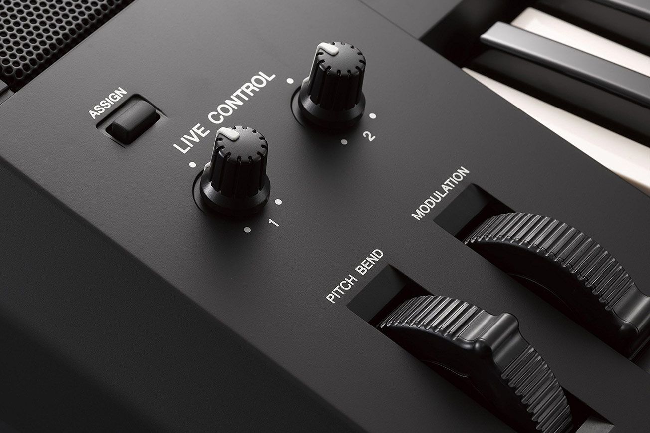 A close up of a keyboard with a live control button