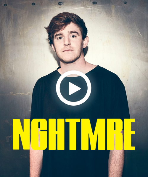 A man is standing in front of a sign that says nightmare