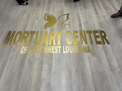 Gold vinyl lettering reading 