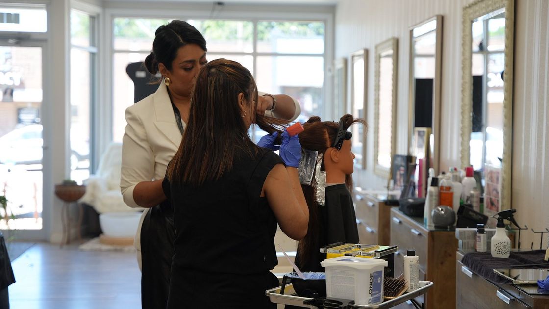 Students practicing in the Levics salon classroom
