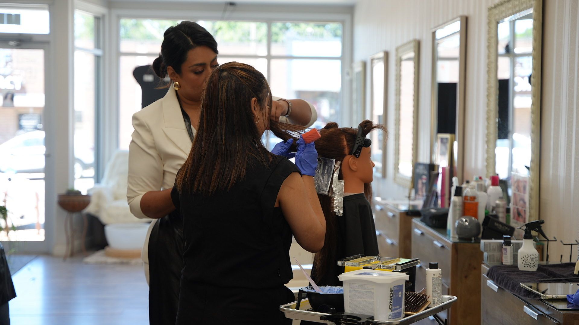Students practicing in the Levics salon classroom