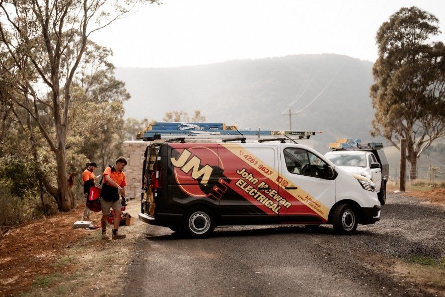 A JME Electrical Van is Parked on the Side of the Road — John McEwan Electrical in Dapto, NSW