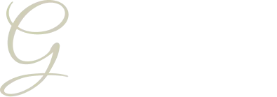 Stylized pale gold cursive letter G on a white background