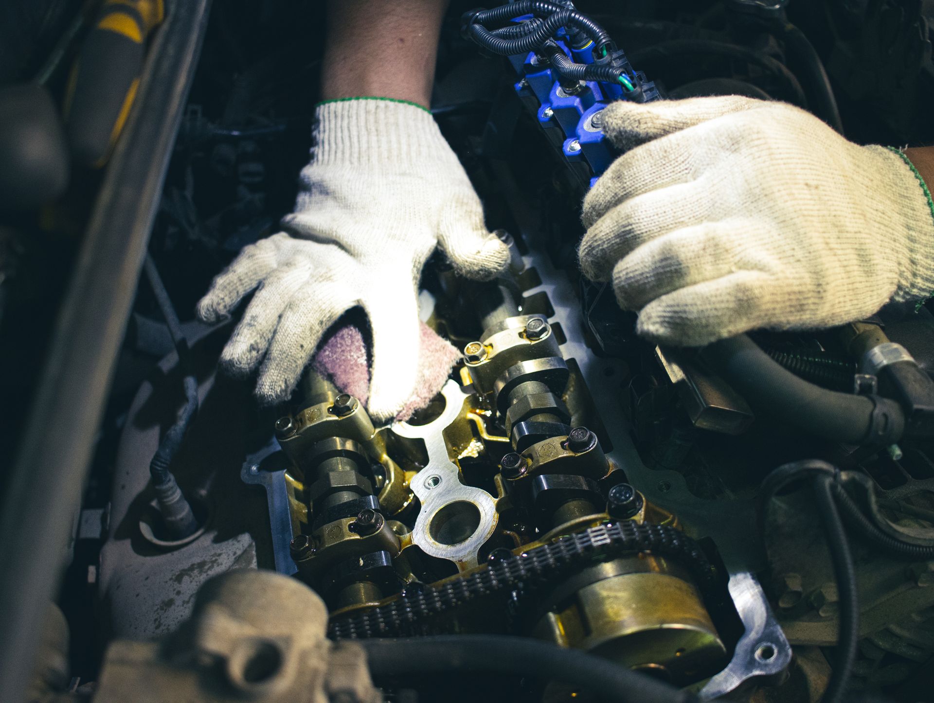 Motor oil being poured into a car engine, highlighting a service process.
