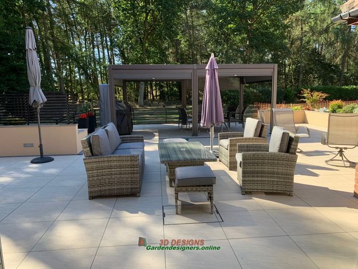 the build A patio with a lot of furniture and umbrellas