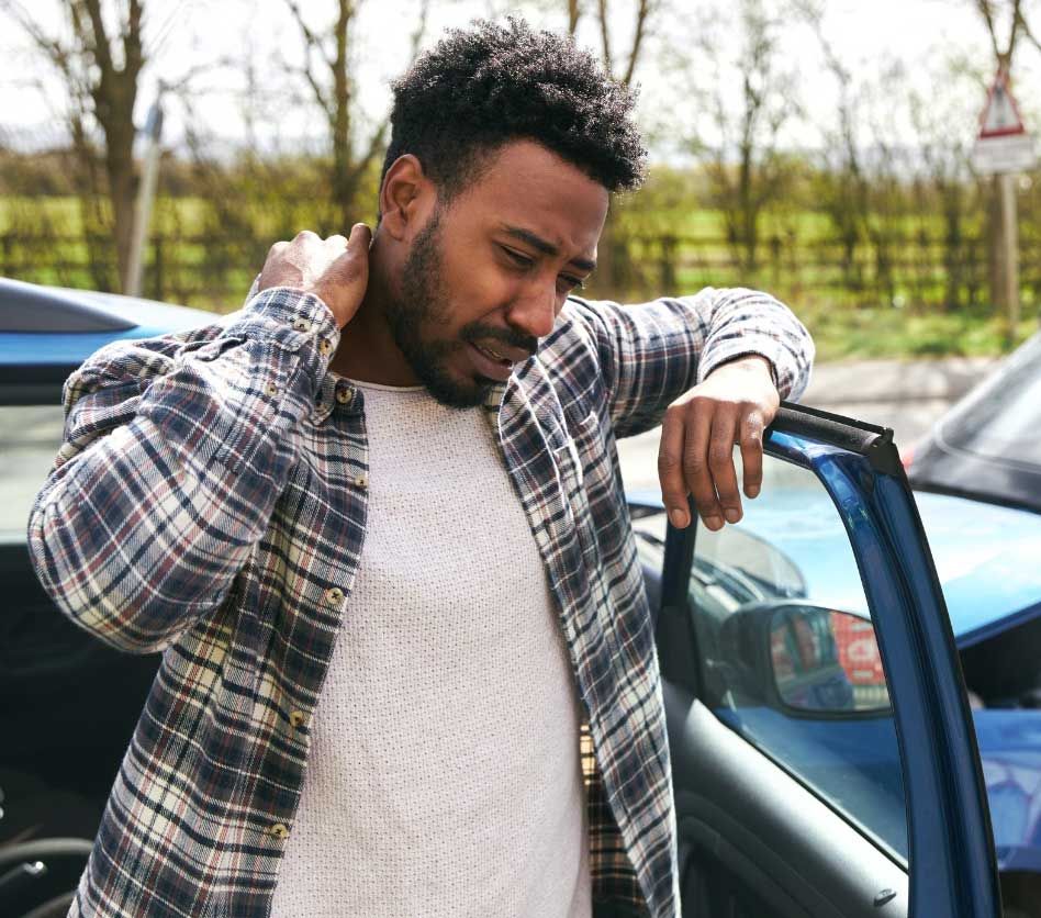 man standing at car door