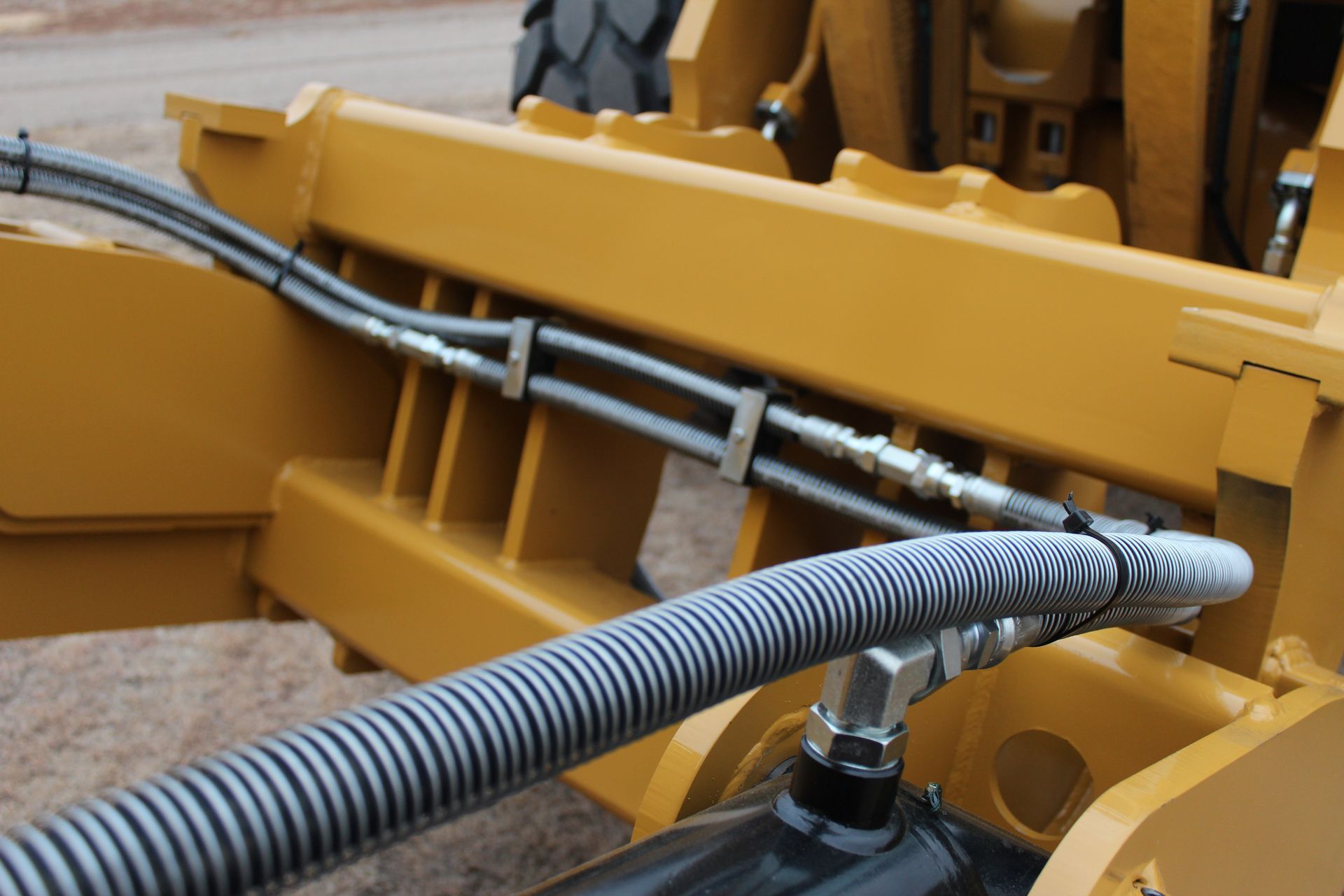 A close up of a hose attached to a rollout bucket