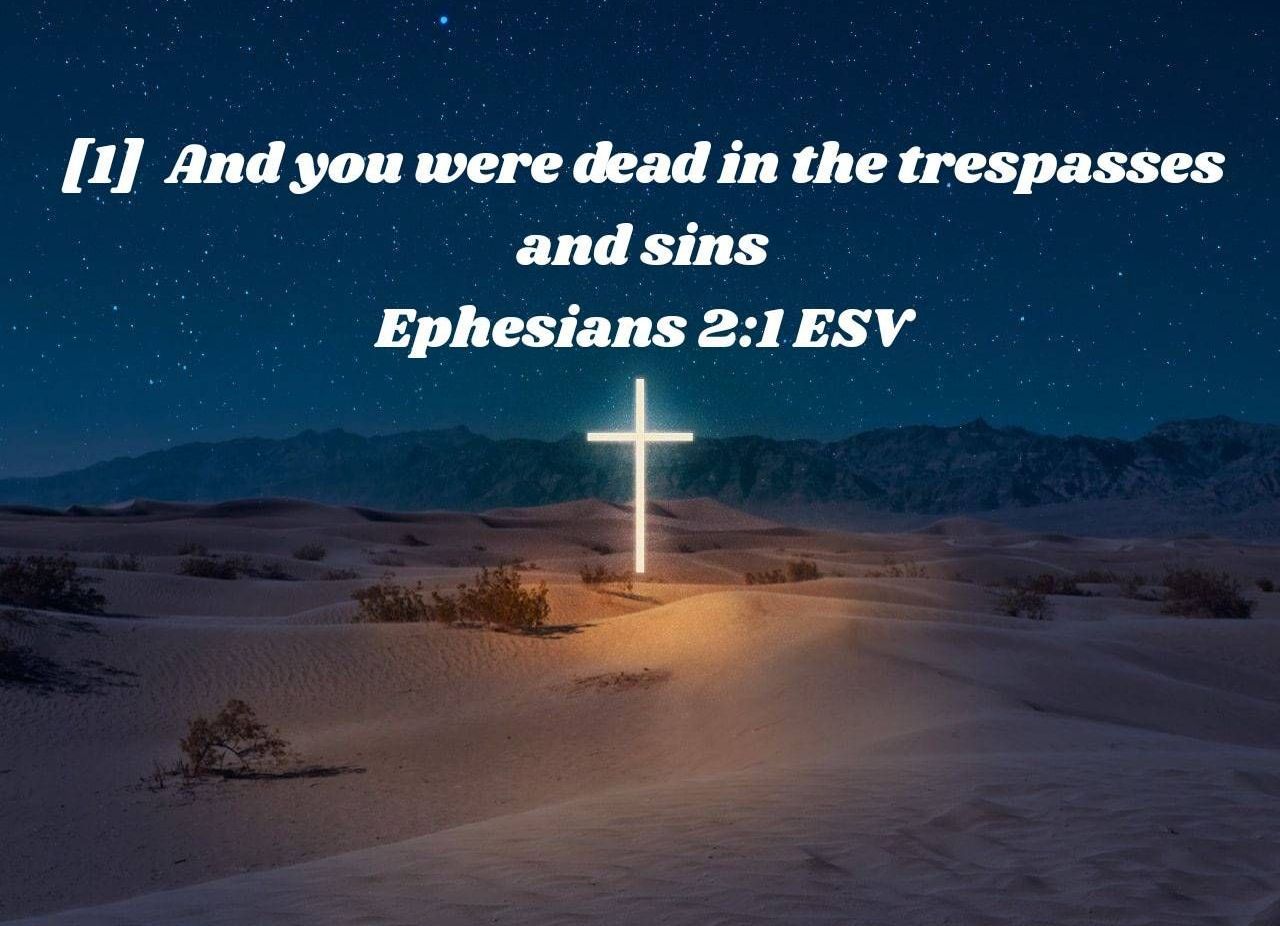 A cross in the desert with a quote from ephesians 2