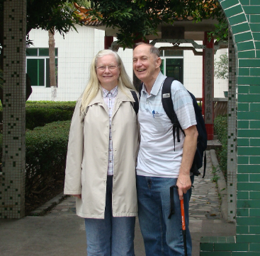 A man and a woman are posing for a picture together