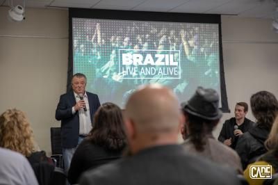 Man speaking at event in front of 