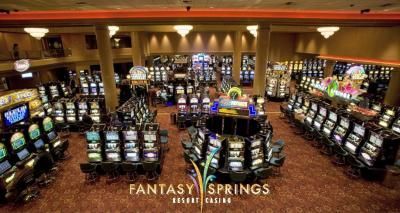 An aerial view of the Fantasy Springs Resort Casino's slots floor. Rows of slot machines, neutral colors.