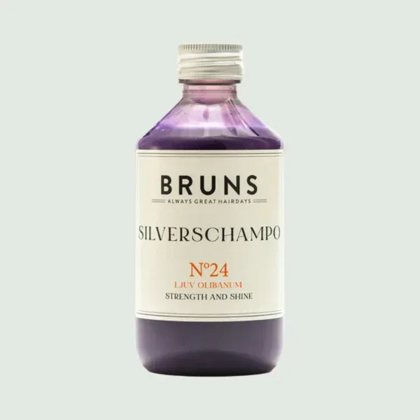 Paarse fles BRUNS zilvershampoo, etiketnummer 24, gecentreerd op een lichte achtergrond.