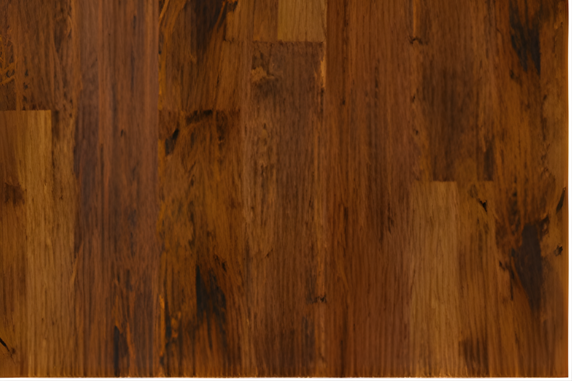 Close-up of warm brown wood grain flooring with visible plank seams